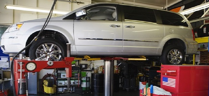 Minivan on a Lift in Shop